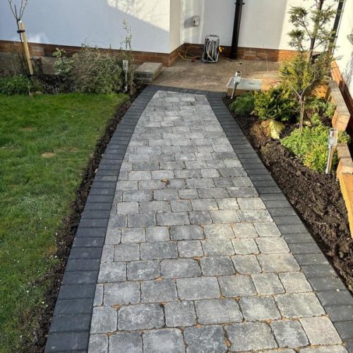 garden transformation cobble paving charcoal borders with kerb flower beds 12